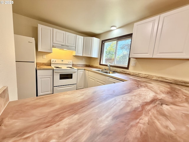 2011/2013 Ohio Ave, North Bend, OR 97459 - kitchen with white appliances, under cabinet range hood, and white cabinetry