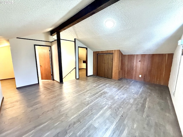 2011/2013 Ohio Ave, North Bend, OR 97459 - bonus room with a textured ceiling, wood finished floors, and wood walls