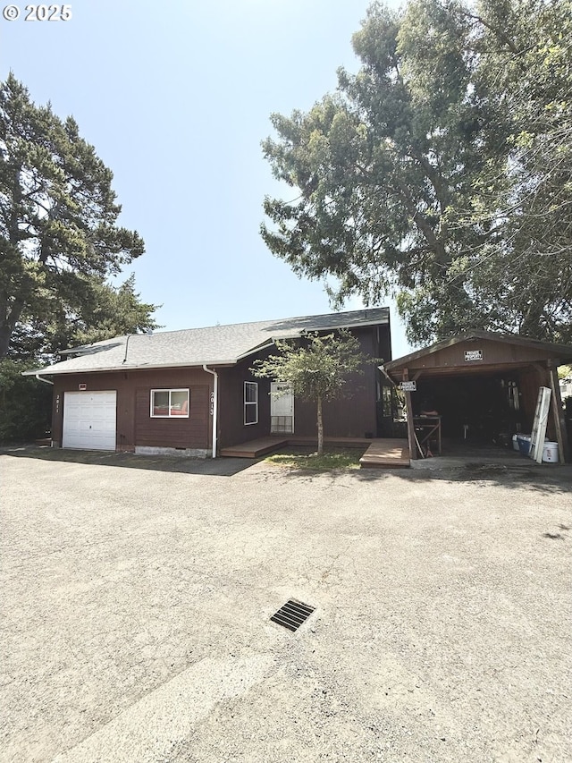2011/2013 Ohio Ave, North Bend, OR 97459 - view of front of home featuring a garage and driveway
