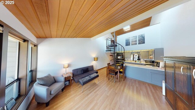 94304 Wedderburn Loop Unit 445, Gold Beach, OR 97444 - living area featuring wooden ceiling, light wood-style floors, and stairs
