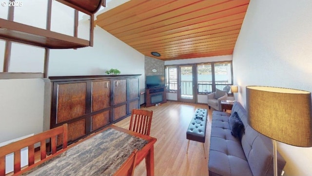 94304 Wedderburn Loop Unit 445, Gold Beach, OR 97444 - living area with lofted ceiling, wood ceiling, and light wood-style flooring