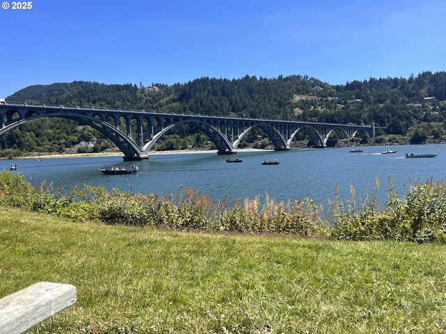 94304 Wedderburn Loop Unit 445, Gold Beach, OR 97444 - water view with a notable bridge and a forest