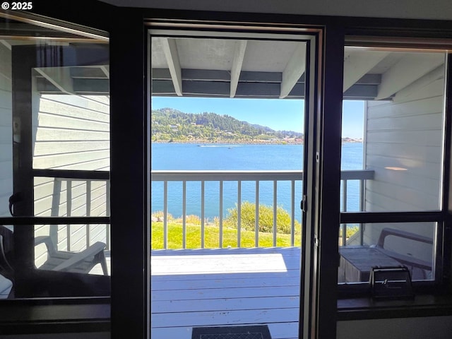 94304 Wedderburn Loop Unit 445, Gold Beach, OR 97444 - doorway featuring a water view and plenty of natural light