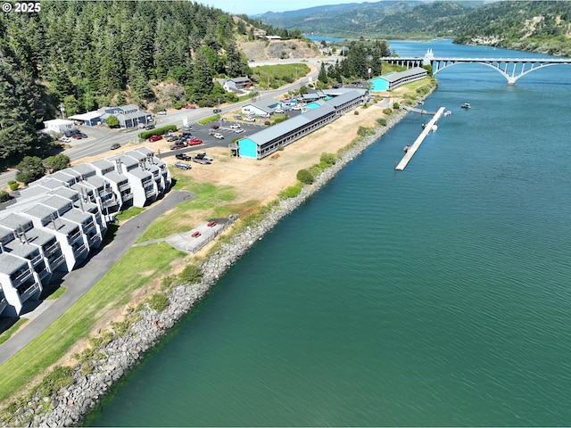 94304 Wedderburn Loop Unit 445, Gold Beach, OR 97444 - drone / aerial view of a water and mountain view and a notable bridge