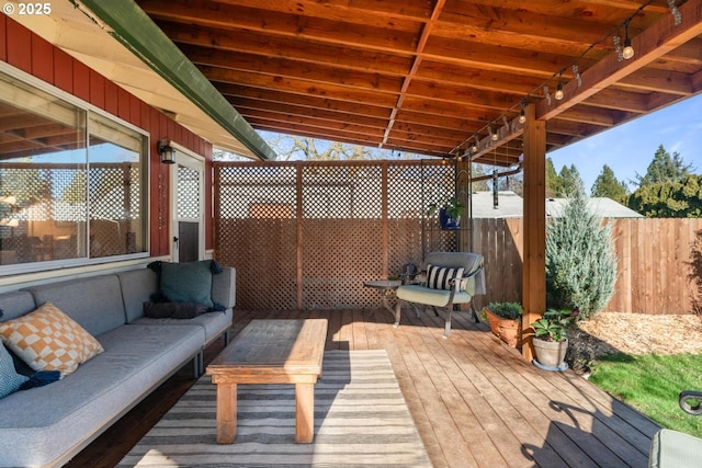 wooden terrace featuring an outdoor hangout area