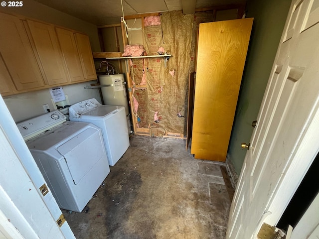 washroom featuring water heater, cabinet space, and washing machine and clothes dryer