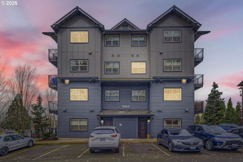 view of back house at dusk