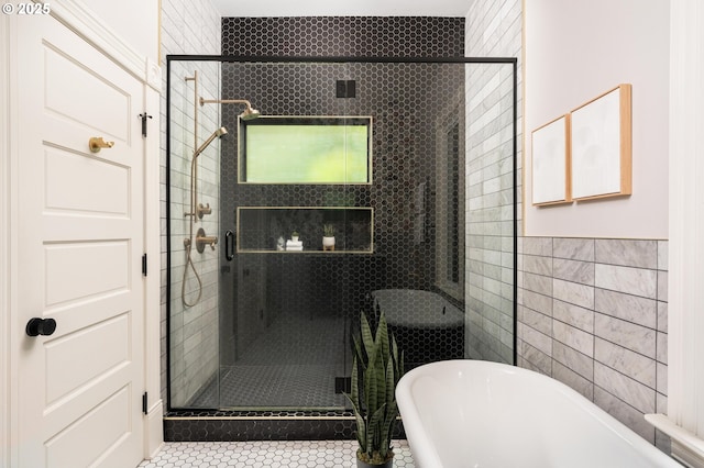 2664 NW Thurman St, Portland, OR 97210 - full bathroom with a freestanding bath, tile walls, a stall shower, and tile patterned flooring
