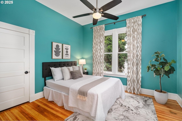 2664 NW Thurman St, Portland, OR 97210 - bedroom featuring wood finished floors, baseboards, and a ceiling fan