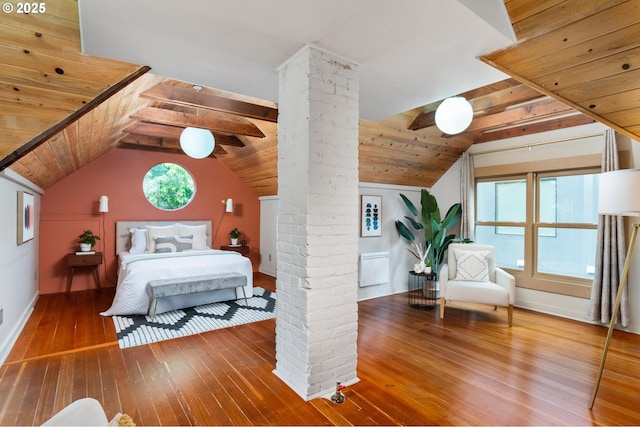 2664 NW Thurman St, Portland, OR 97210 - bedroom featuring ornate columns, hardwood / wood-style flooring, vaulted ceiling, wooden ceiling, and baseboards