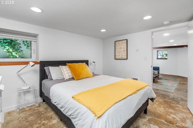 2664 NW Thurman St, Portland, OR 97210 - bedroom with concrete flooring, recessed lighting, and baseboards