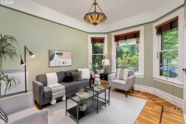 2664 NW Thurman St, Portland, OR 97210 - living room with a chandelier and baseboards