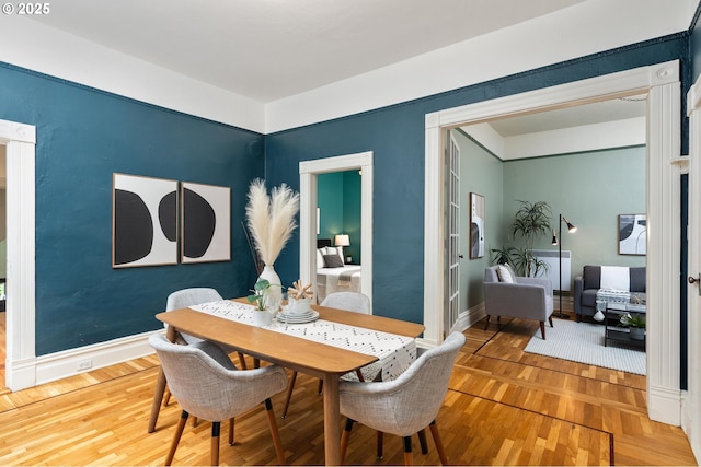 2664 NW Thurman St, Portland, OR 97210 - dining area featuring wood finished floors and baseboards