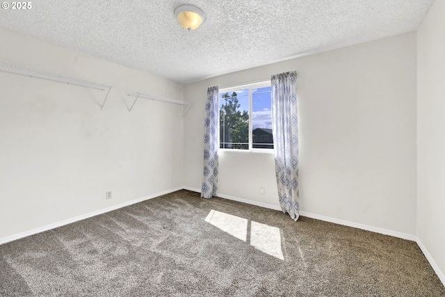 523 65th St, Springfield, OR 97478 - carpeted spare room with a textured ceiling and baseboards