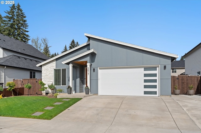 2417 NE 2nd Ct, Battle Ground, WA 98604 - mid-century home featuring concrete driveway, an attached garage, and stone siding