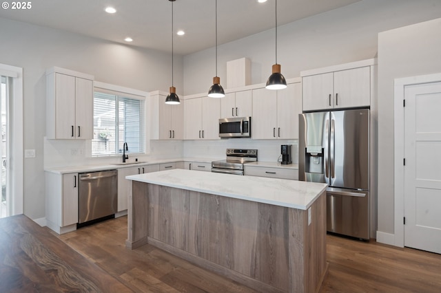 2417 NE 2nd Ct, Battle Ground, WA 98604 - kitchen featuring appliances with stainless steel finishes, a center island, dark wood-type flooring, recessed lighting, and a sink