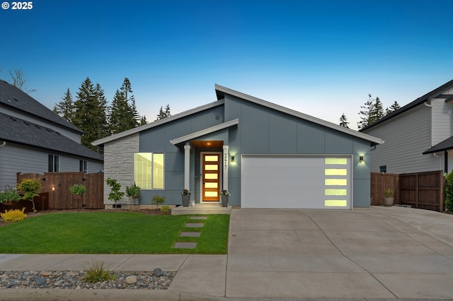 2417 NE 2nd Ct, Battle Ground, WA 98604 - contemporary home featuring driveway, an attached garage, and board and batten siding