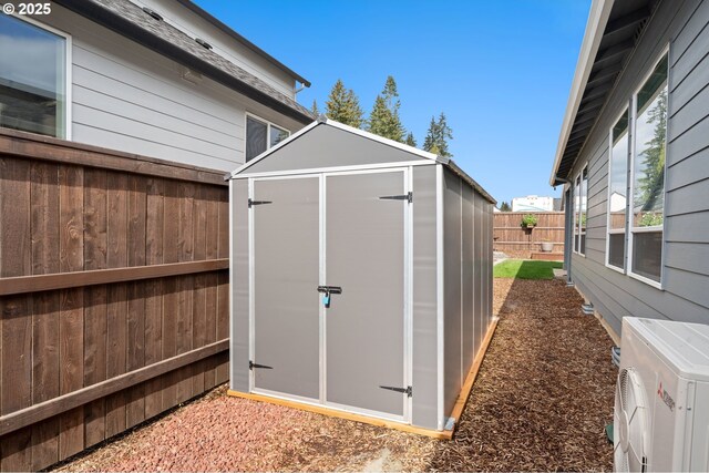 2417 NE 2nd Ct, Battle Ground, WA 98604 - view of shed featuring ac unit and a fenced backyard