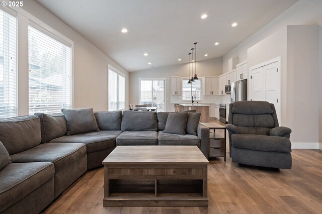 2417 NE 2nd Ct, Battle Ground, WA 98604 - living room featuring recessed lighting, wood finished floors, and vaulted ceiling