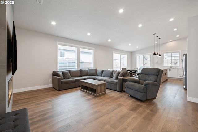 2417 NE 2nd Ct, Battle Ground, WA 98604 - living room with wood finished floors, recessed lighting, baseboards, and lofted ceiling