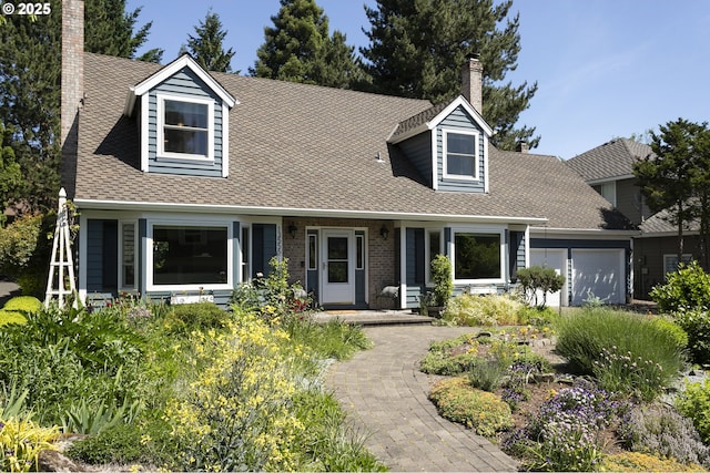 13555 SW Hiteon Ct, Beaverton, OR 97008 - cape cod house with a garage, a chimney, and roof with shingles