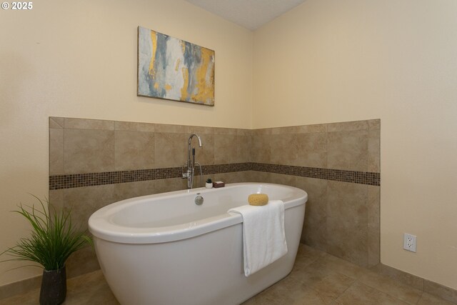 13555 SW Hiteon Ct, Beaverton, OR 97008 - full bath with a freestanding tub, tile walls, and tile patterned flooring