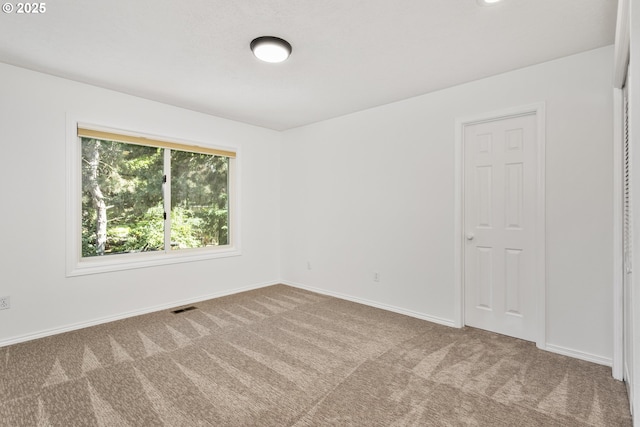13555 SW Hiteon Ct, Beaverton, OR 97008 - empty room featuring carpet flooring and baseboards
