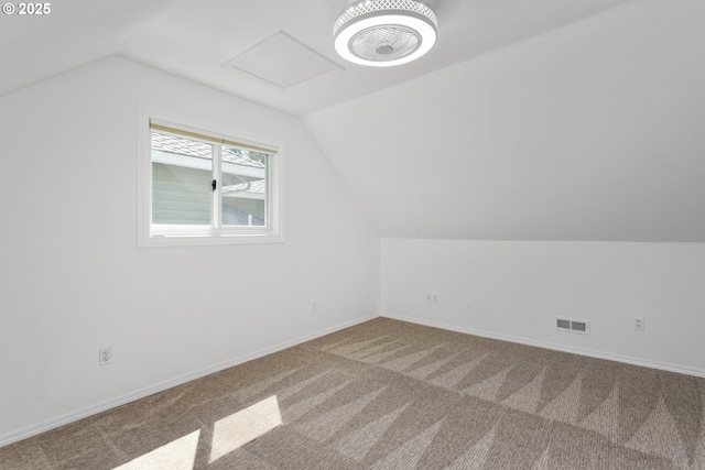 13555 SW Hiteon Ct, Beaverton, OR 97008 - additional living space with lofted ceiling, carpet flooring, and attic access