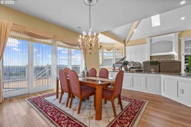 9337 SE Pennington Ct, Happy Valley, OR 97086 - dining area featuring a chandelier, light wood-style floors, recessed lighting, and vaulted ceiling