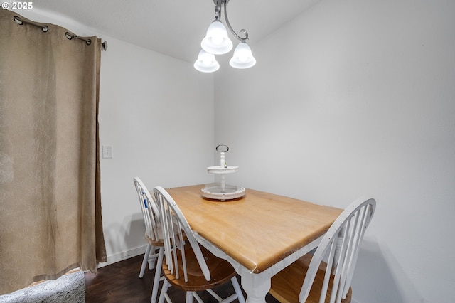 dining room with dark wood-type flooring