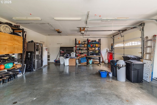 garage featuring stainless steel fridge