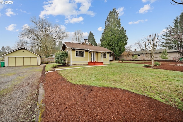 ranch-style home with a garage, an outdoor structure, and a front lawn