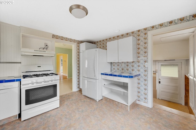 kitchen with white cabinets and white appliances