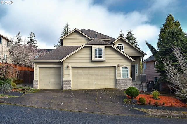 traditional-style house with fence, brick siding, driveway, and roof with shingles