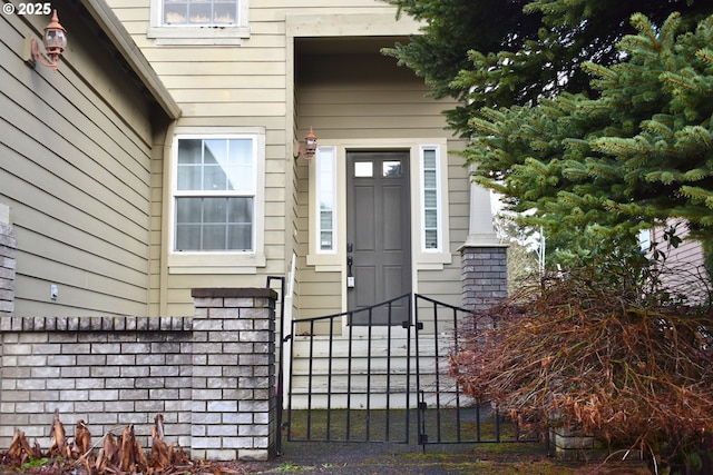 doorway to property featuring fence