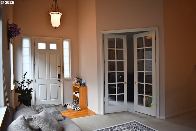 entrance foyer with french doors and baseboards