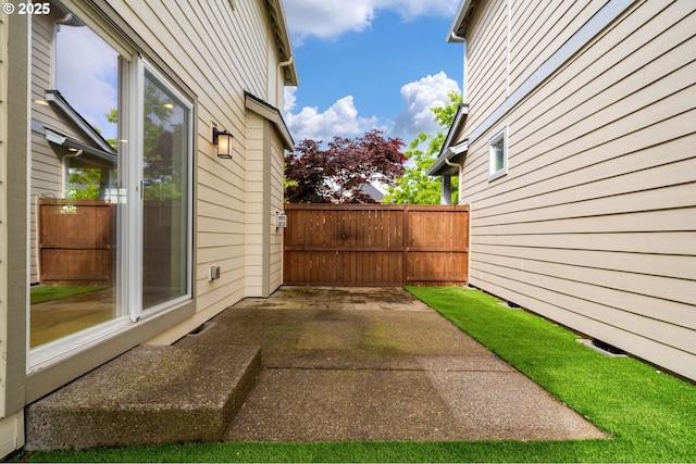 view of patio featuring fence