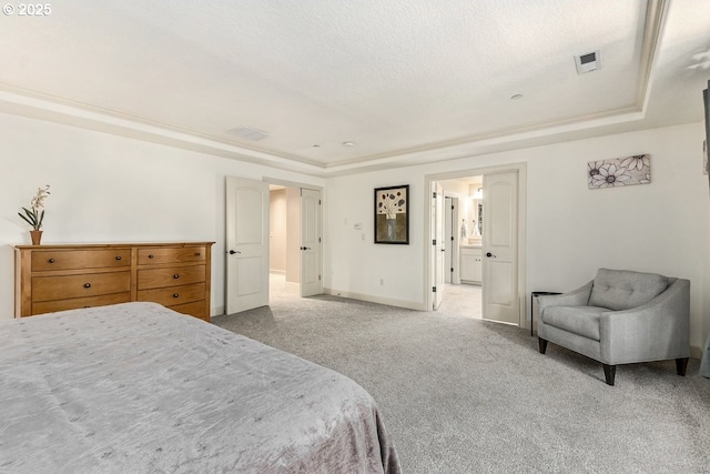 bedroom featuring visible vents, baseboards, a tray ceiling, a textured ceiling, and carpet flooring