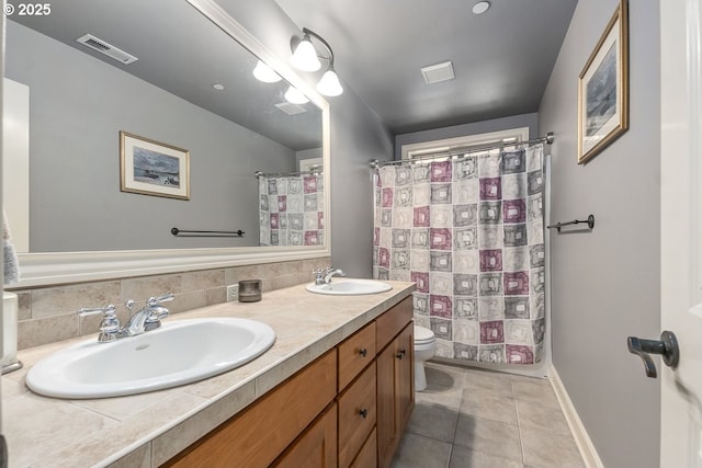 full bathroom with tile patterned floors, toilet, visible vents, and a sink