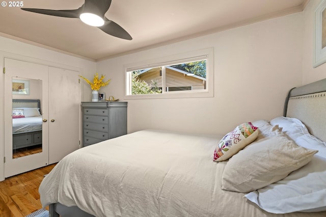 7750 SW 4th Ave, Portland, OR 97219 - bedroom featuring wood finished floors, ceiling fan, a closet, and ornamental molding