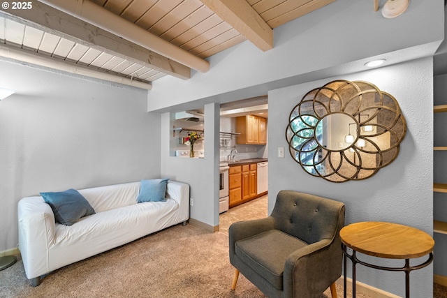 7750 SW 4th Ave, Portland, OR 97219 - living area featuring light carpet, wooden ceiling with exposed beams, and baseboards