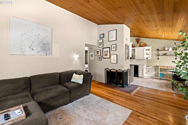7750 SW 4th Ave, Portland, OR 97219 - living room with wood ceiling, lofted ceiling, light wood-style floors, and a fireplace