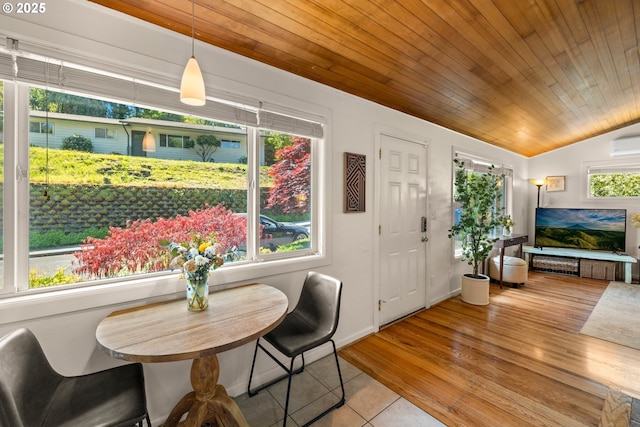 7750 SW 4th Ave, Portland, OR 97219 - dining space featuring light tile patterned floors, wooden ceiling, vaulted ceiling, and baseboards