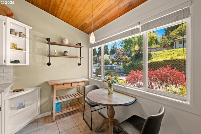 7750 SW 4th Ave, Portland, OR 97219 - dining space with wood ceiling, plenty of natural light, light tile patterned floors, and lofted ceiling