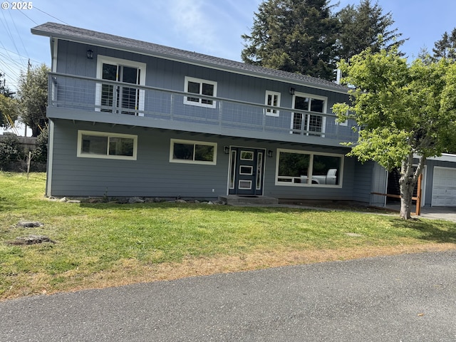 29700 Park Dr, Gold Beach, OR 97444 - view of front of property featuring a front yard, a balcony, and a shingled roof