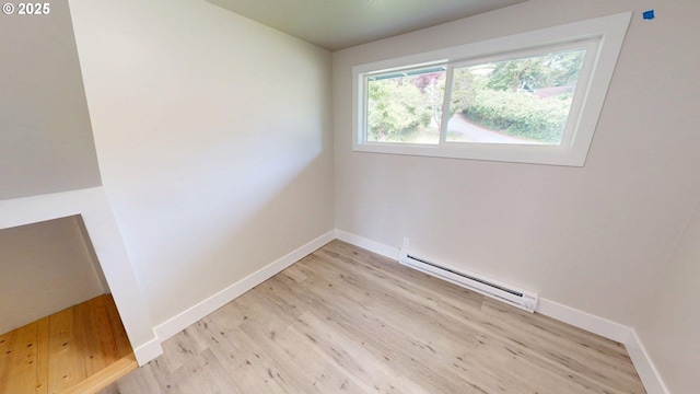 29700 Park Dr, Gold Beach, OR 97444 - spare room with baseboard heating, light wood-type flooring, and baseboards