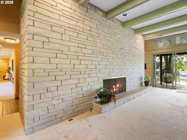 6600 SW Montgomery Way, Wilsonville, OR 97070 - unfurnished living room with carpet floors, beam ceiling, an outdoor stone fireplace, and wooden walls