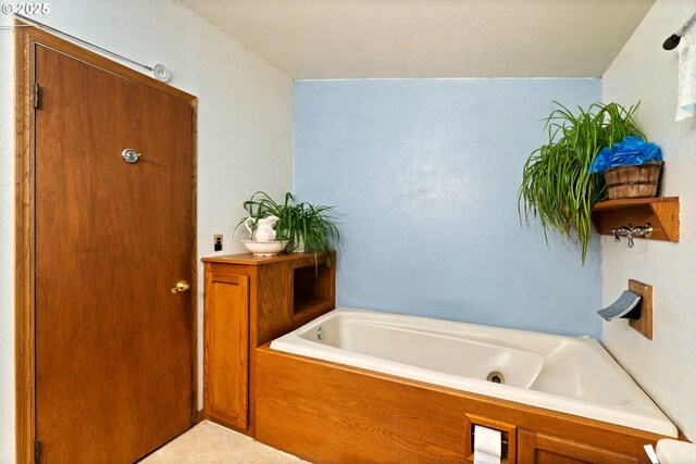 full bathroom with a jetted tub