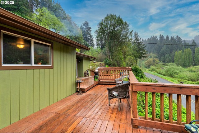 deck featuring a view of trees