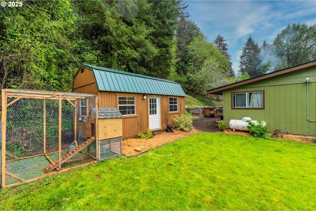 view of poultry coop featuring a yard